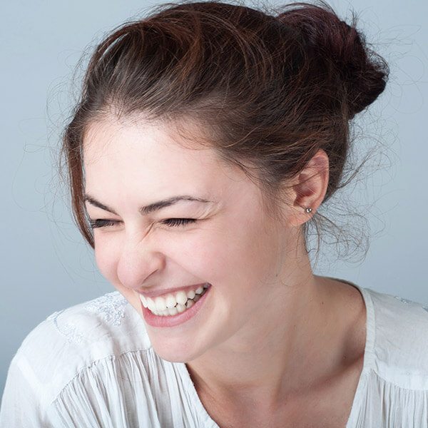 Young woman happily smiling 